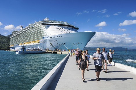 Passengers disembark the Royal Caribbean Cruise ship the Oasis of the Seas for a day of beach activities. With a passenger capacity of over six thousand, the Oasis of the Seas is the largest cruise ship in the world to date.