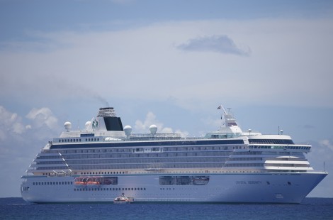 Avarua, Cook Islands - February 2, 2009: Cruise Ship "Crystal Serenity" anchored in front of the reef of Avarua, Cook Islands. Owner is the cruise line Crystal Cruises. They offer around the world voyages. Crystal Serenity was built in 2003, has a capacity of 1070 passengers and is 820 feet long and 25 feet wide.